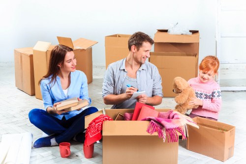 Packed household boxes and protected furniture ready for a Knightsbridge apartment relocation