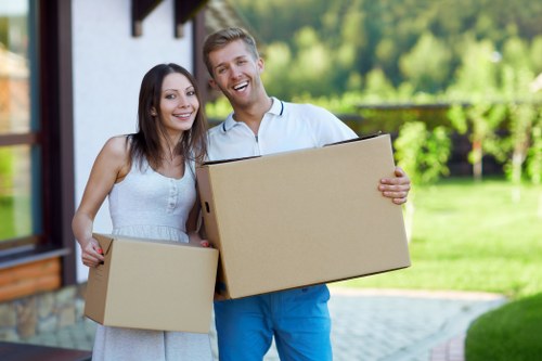 Local packing team organising belongings in a central London apartment