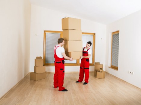 Team handling furniture during a relocation service